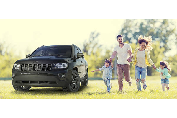 Playful family running outdoors.
